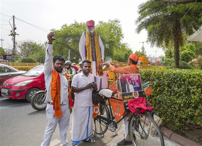 BJP supporters outside the party headquarters on the day of counting of votes for Lok Sabha polls.