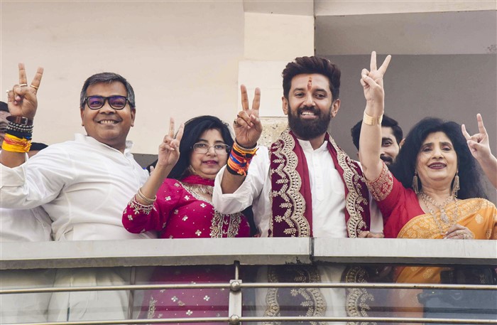 LJP (Ram Vilas) Chief Chirag Paswan shows victory sign during celebrations of the party's lead in the Lok Sabha elections as counting of votes underway, in Patna.