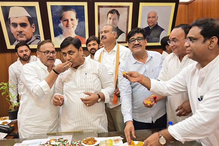 Rajasthan Congress chief Govind Singh Dotasra with party leader celebrates their gain in Lok Sabha polls during counting of votes, in Jaipur.