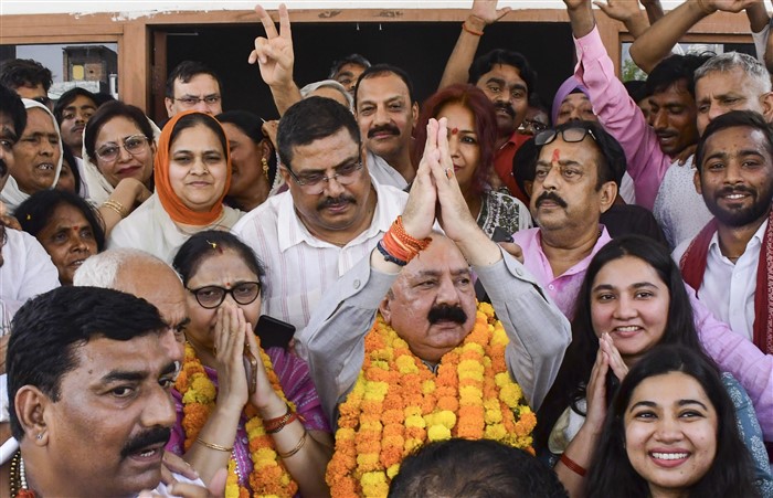 Congress candidate from Amethi constituency Kishori Lal Sharma celebrates with others as he leads in the Lok Sabha elections on the day of the counting of votes, in Amethi.