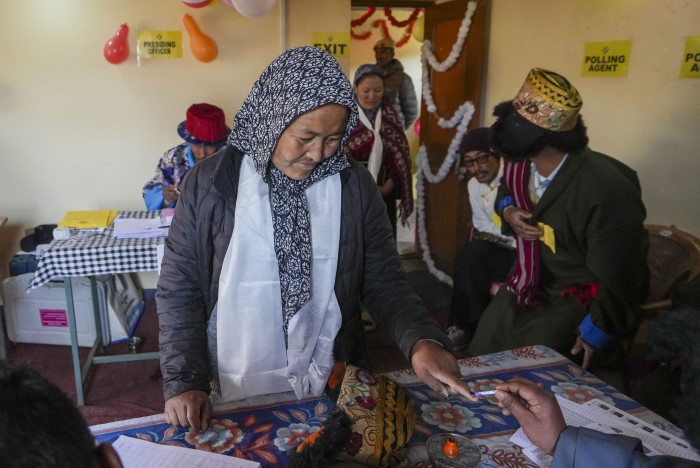 Lahaul and Spiti: A voter gets her finger marked with indelible ink before casting her vote for the seventh and last phase of Lok Sabha polls