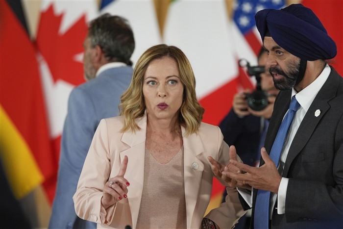World Bank president Ajay Banga, right, speaks with Italian Prime Minister Giorgia Meloni during the Partnership for global infrastructure and investment event at the G7 summit.