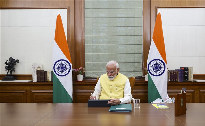 Prime Minister Narendra Modi takes charge of the office, in New Delhi.