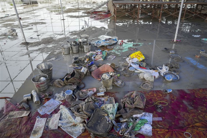 Belongings of followers of Bhole Baba lying at the scene a day after a massive stampede that took place during a 'satsang' (religious congregation), in Sikandara Rao area in Hathras district