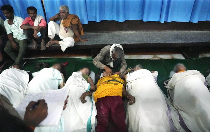 Bodies of victims of the Hathras stampede lie at Bagla District Hospital, in Hathras.