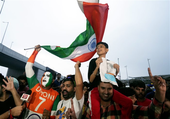 Fans gather to welcome the T20 World Cup-winning Indian cricket team at New Delhi airport.