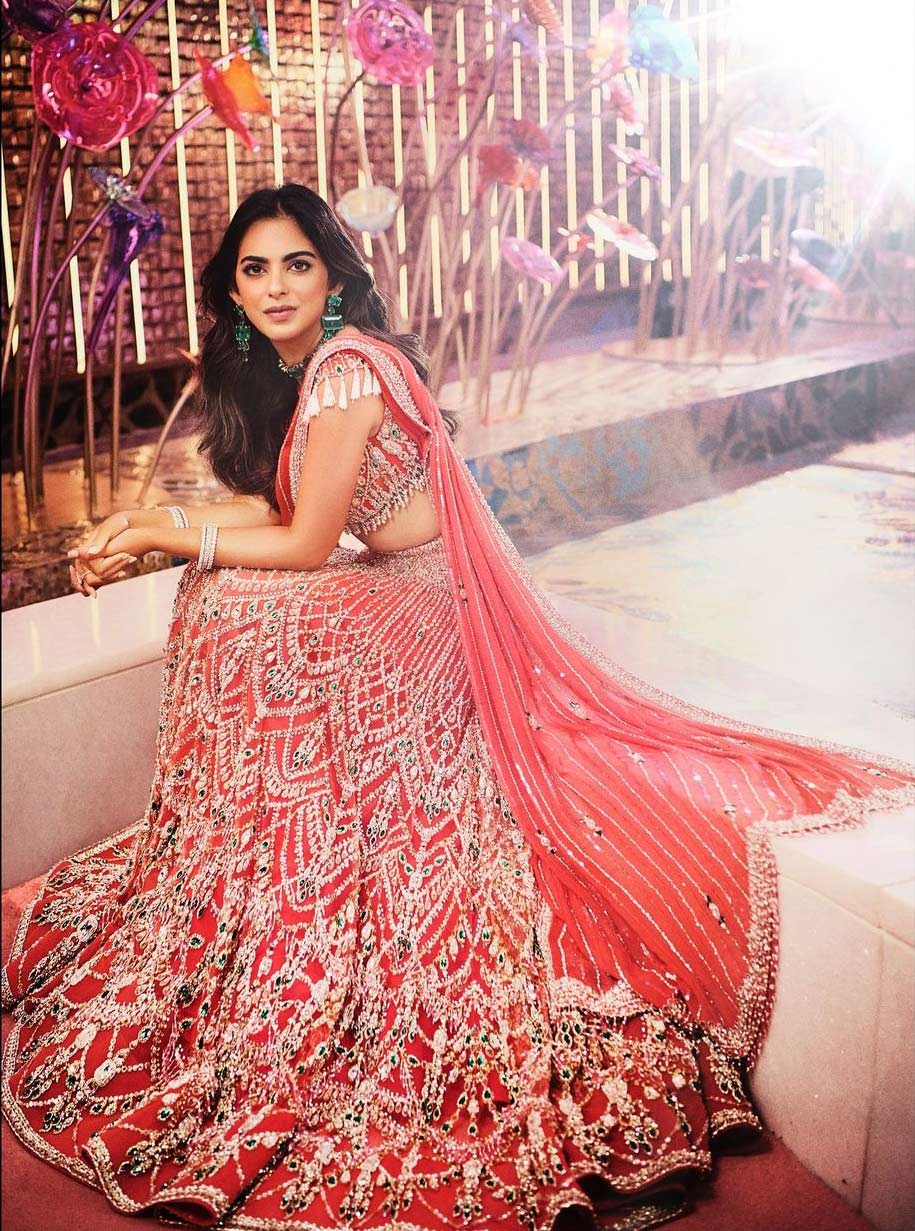 Isha chose a pink Falguni Shane Peacock lehenga set featuring a bralette, an A-line lehenga skirt and matching dupatta.