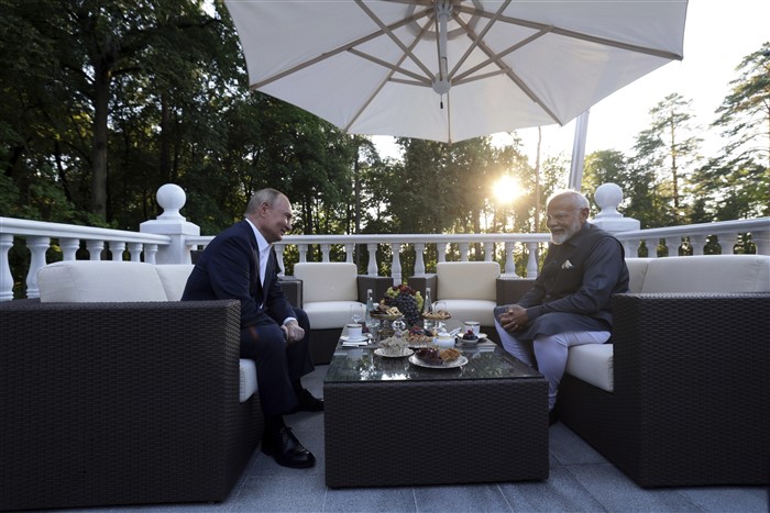 Russian President Vladimir Putin, left, speaks with Indian Prime Minister Narendra Modi during an informal meeting at Novo-Ogaryovo residence.