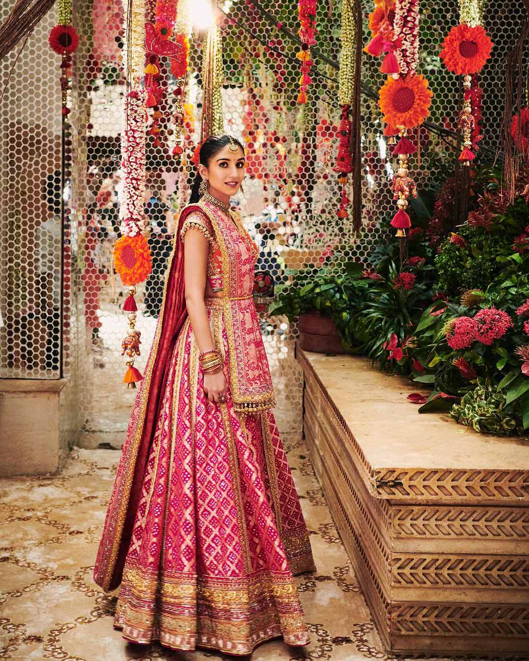 Radhika Merchant stuns in a breathtaking Bandhani lehenga, exuding timeless elegance