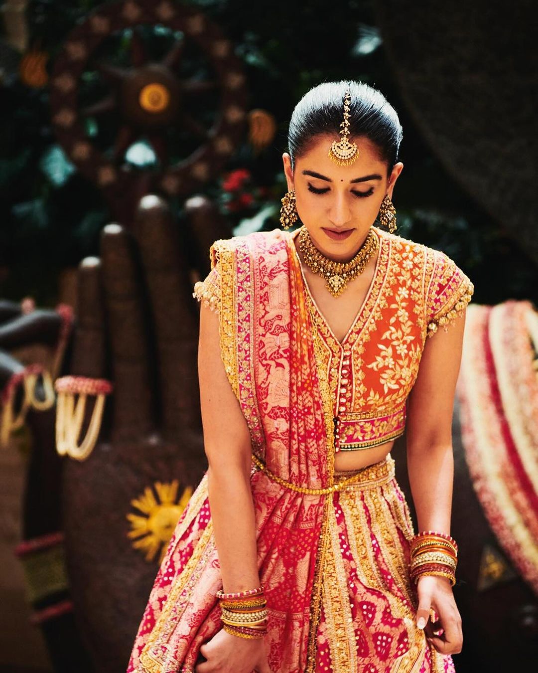 In a mesmerizing Bandhani lehenga, Radhika Merchant captures hearts with her traditional charm.
