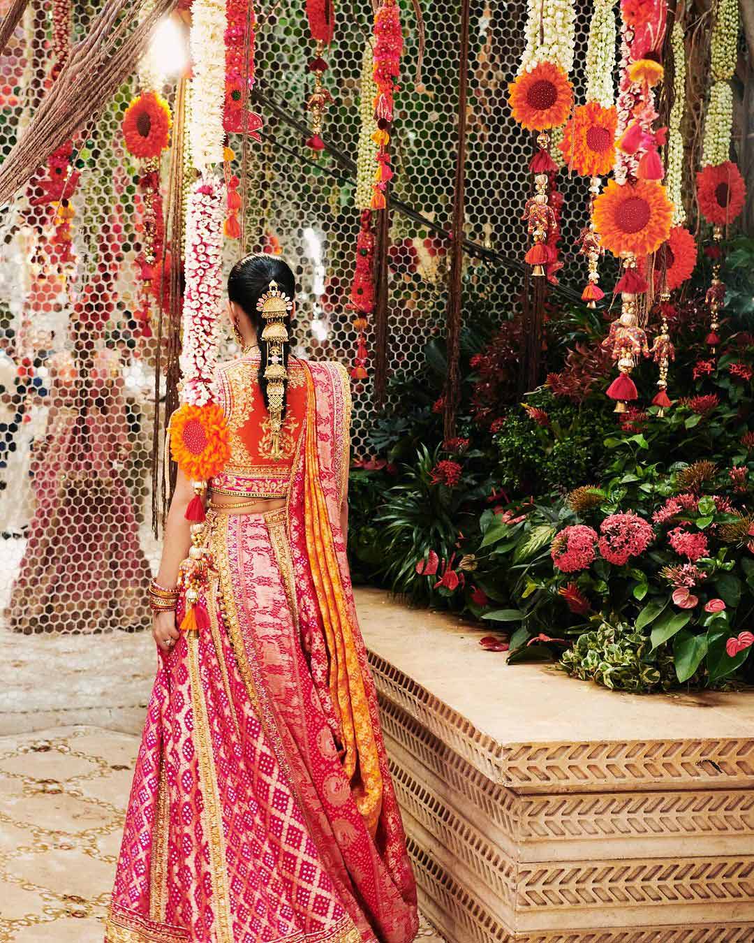 Radhika Merchant radiates beauty in her exquisite Bandhani lehenga, turning heads everywhere.