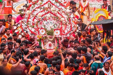 Devotees carry an idol during the annual ‘Rath Yatra’, in Puri.