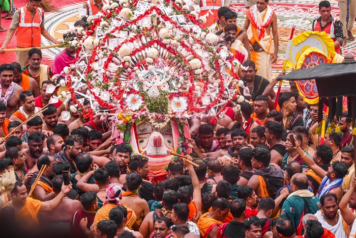 Devotees carry an idol during the annual ‘Rath Yatra’, in Puri.