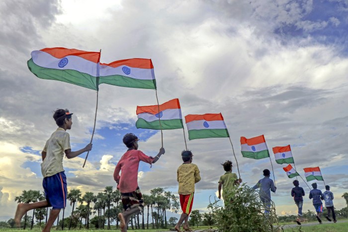 Birbhum: Students pose with Indian national flags as part of 'Har Ghar Tiranga' campaign ahead of the Independence Day on the outskirts of Bolpur, in Birbhum district, Monday, Aug. 12, 2024.