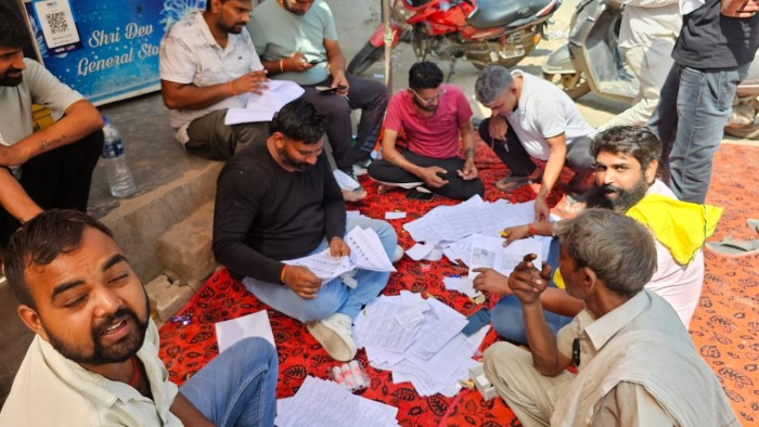 Party workers in Haryana are actively guiding voters during the election.