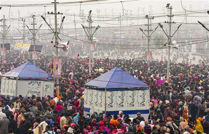 Devotees gather to take a holy dip at the Sangam on the first day of Maha Kumbh Mela 2025, in Prayagraj, Uttar Pradesh, Monday, Jan. 13, 2025.