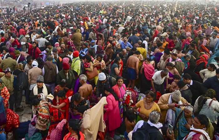 Devotees gather to take a holy dip at the Sangam on the first day of Maha Kumbh Mela 2025, in Prayagraj, Uttar Pradesh, Monday, Jan. 13, 2025.