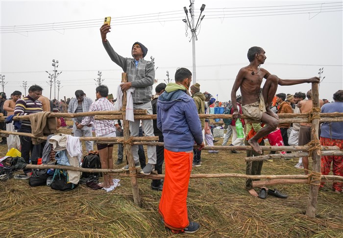 Devotees gather to take a holy dip at the Sangam on the first day of Maha Kumbh Mela 2025, in Prayagraj, Uttar Pradesh, Monday, Jan. 13, 2025.