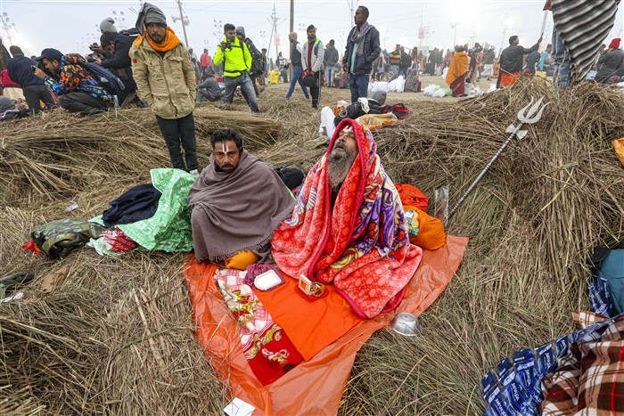 Devotees perform rituals at Sangam on the first day of Maha Kumbh Mela 2025, in Prayagraj, Uttar Pradesh, Monday, Jan. 13, 2025.