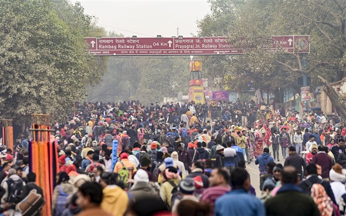 Devotees leave after taking a holy dip at Sangam on the first day of Maha Kumbh Mela 2025, in Prayagraj, Uttar Pradesh, Monday, Jan. 13, 2025.