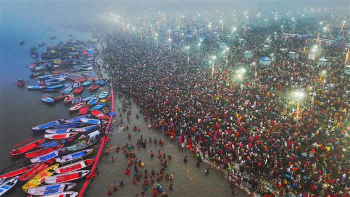 Devotees take a holy dip at Sangam during Maha Kumbh Mela 2025, in Prayagraj, Uttar Pradesh.