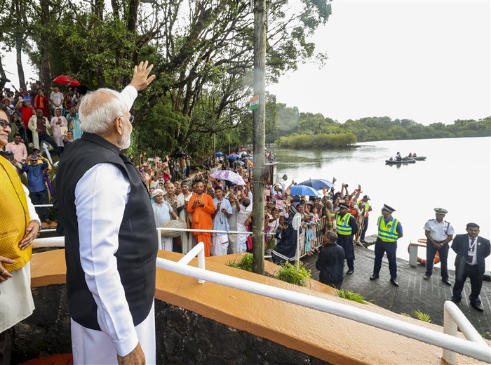 PMO on March 12, 2025, Prime Minister Narendra Modi offers 'Ganga Jal' into Ganga Talao, at the Ganga Talao in Mauritius.