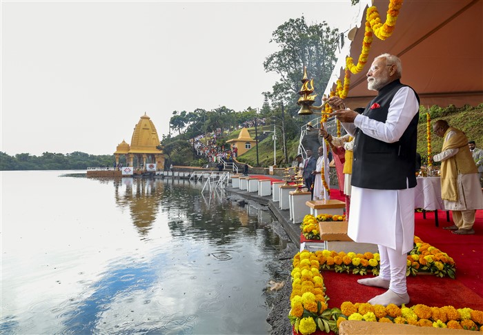 PMO on March 12, 2025, Prime Minister Narendra Modi offers 'Ganga Jal' into Ganga Talao, at the Ganga Talao in Mauritius.