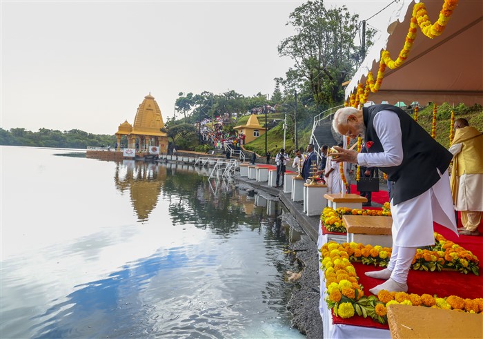 PMO on March 12, 2025, Prime Minister Narendra Modi offers 'Ganga Jal' into Ganga Talao, at the Ganga Talao in Mauritius.