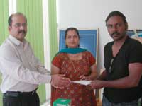 Dubai Tamil woman handover cash aid to Lawrence Trust Dubai Tamil woman handover cash aid to Lawrence Trust