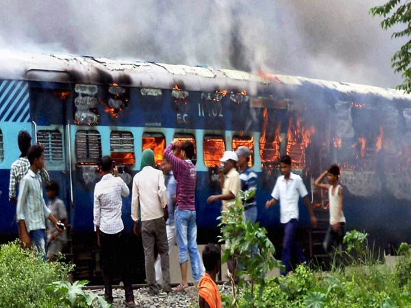 Angry people set ablaze Raj Rani Express train after it ran over pilgrims at Dhamara railway station