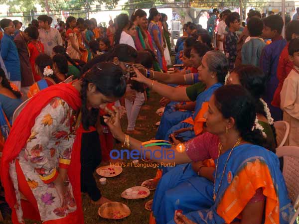 Students Perform Pada Pooja to Parents