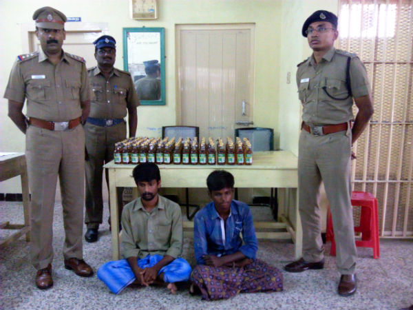 Police seize auto and liquor bottles near Courtallam