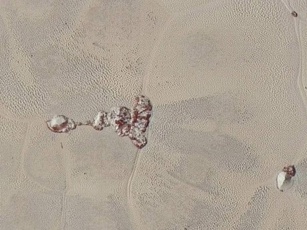 'Snake skin' photos reveal Pluto in dazzling details