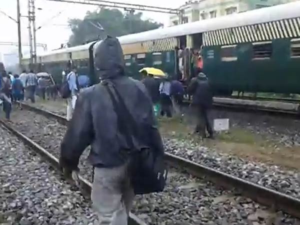 Chennai stopped train and people walked along track Chennai stopped train and people walked along track