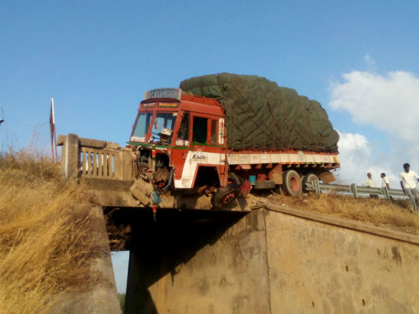Lorry hangs from birdge after met with accident