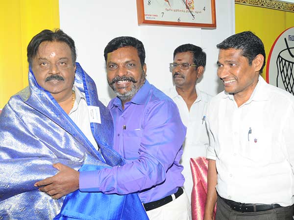 Vijayakanth feeds cake to PWF leaders on his birth day