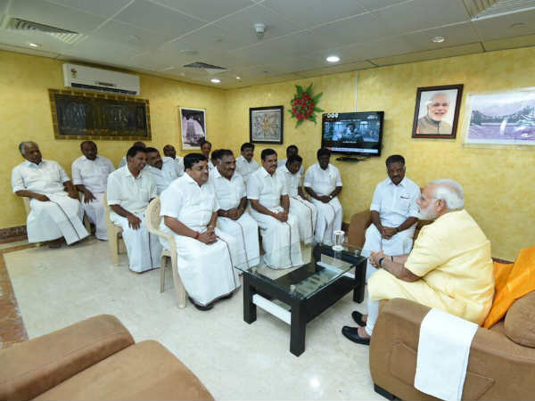 OPS meets PM Modi at Madurai Airport 