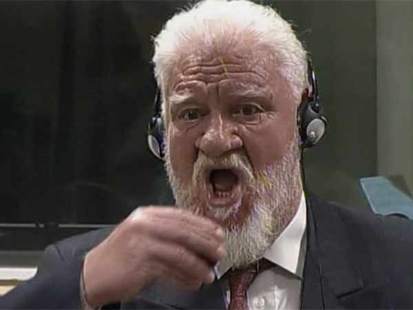 Bosnian war Criminal Dies in International Court in front of Judge by drinking Poison Bosnian war Criminal Dies in International Court in front of Judge by drinking Poison