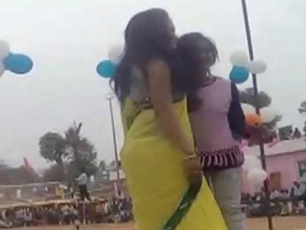Students write exam on terrace as the dancers perform in school ground 