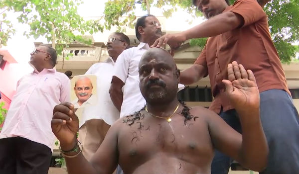Congress man tonsures his head for Vaithilingam