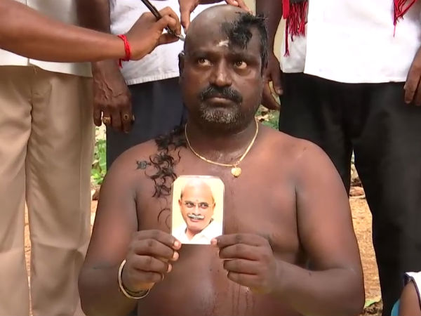 Congress man tonsures his head for Vaithilingam