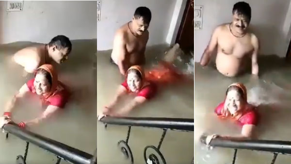 Husband and Wife swimming in house in Flood Husband and Wife swimming in house in Flood