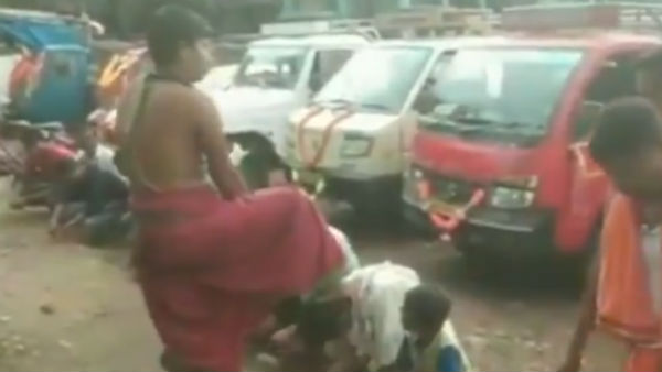 A video on priest putting his foot on People heads goes viral A video on priest putting his foot on People heads goes viral