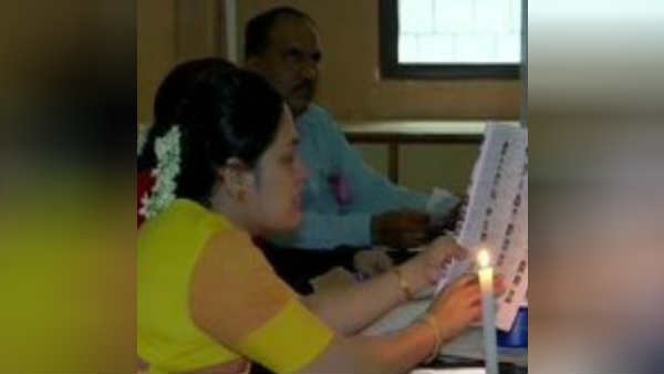 Voting held in candlelight due to no electricity in pune Voting held in candlelight due to no electricity in pune