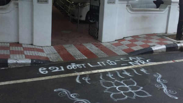 Men opposing citizenship Amendment Act and nrc, using Rangoli 