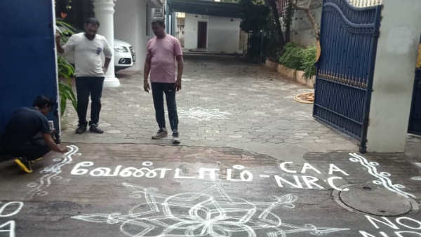 Men opposing citizenship Amendment Act and nrc, using Rangoli 