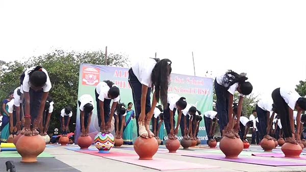 In Puducherry Beach Road School students perform various yoga poses 