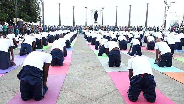 In Puducherry Beach Road School students perform various yoga poses 