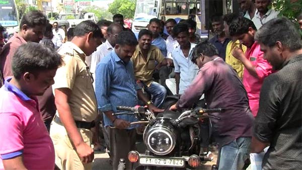 A snake in a young mans two-wheeler 