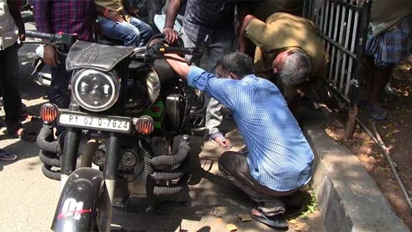 A snake in a young mans two-wheeler 